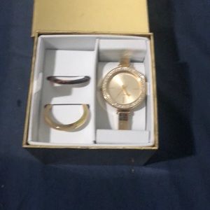 Michael kors watch gold with gems around the face